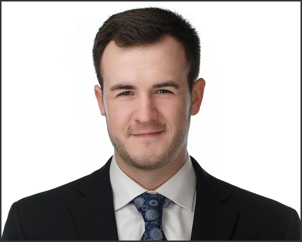 A headshot on a white background for a new hire at a Denver, Colorado recycling corporation.