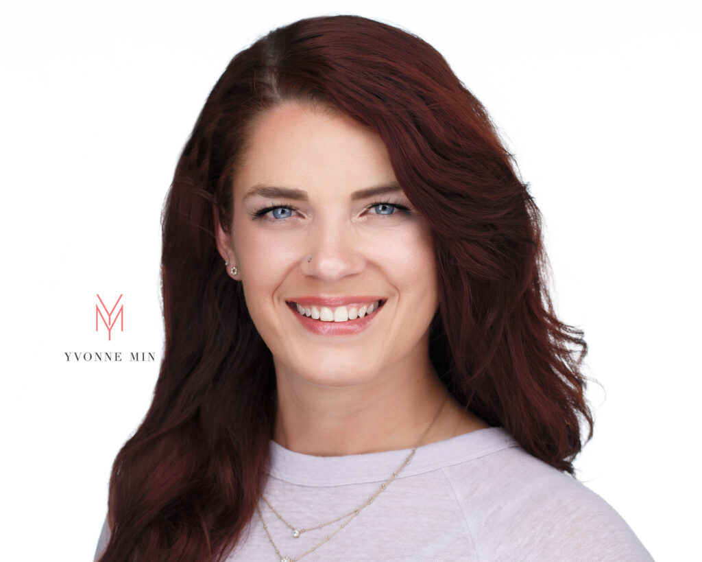 Headshot of a child physical therapist on a white backdrop taken in the studio of Yvonne Min Photography in Thornton, Colorado.