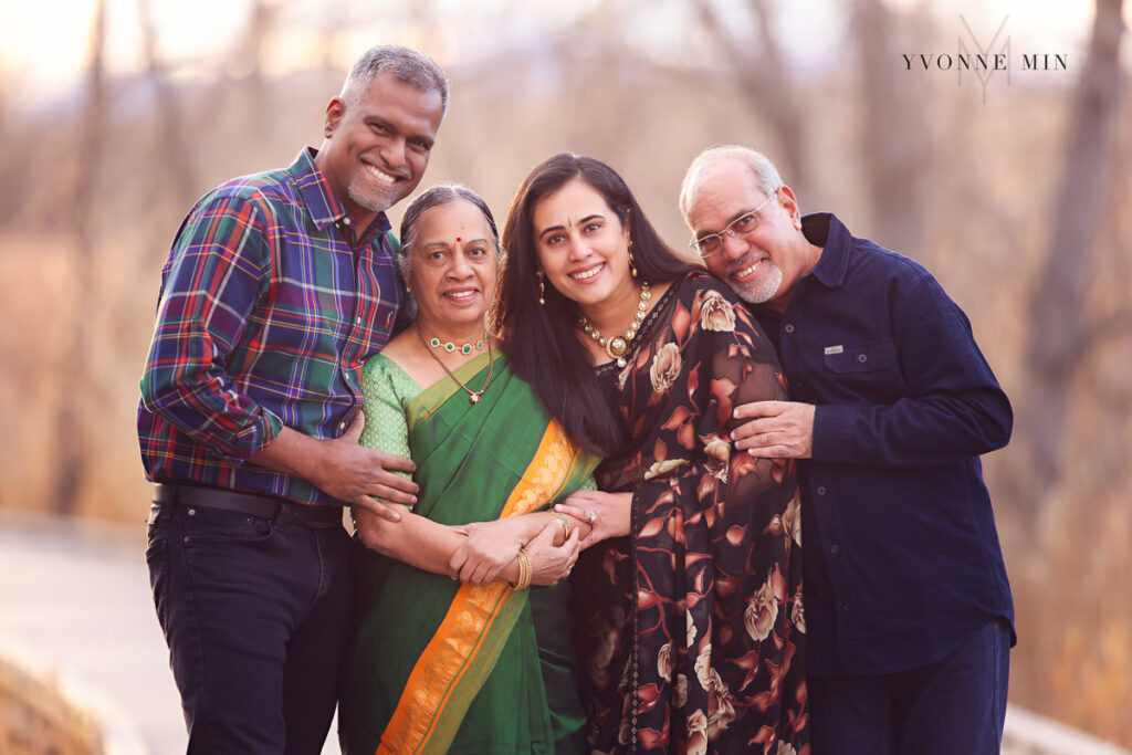 Grandparents and parents pose together with traditional Indian sarees at a photoshoot with Yvonne Min Photography.