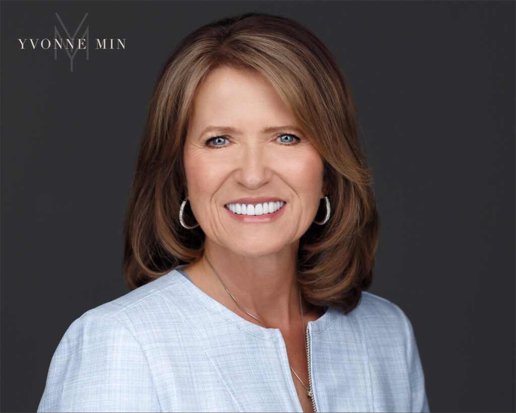 Headshot of a woman recently named program director at The Conference Board in Denver, Colorado photographed by Yvonne Min Photography in Thornton, Colorado.