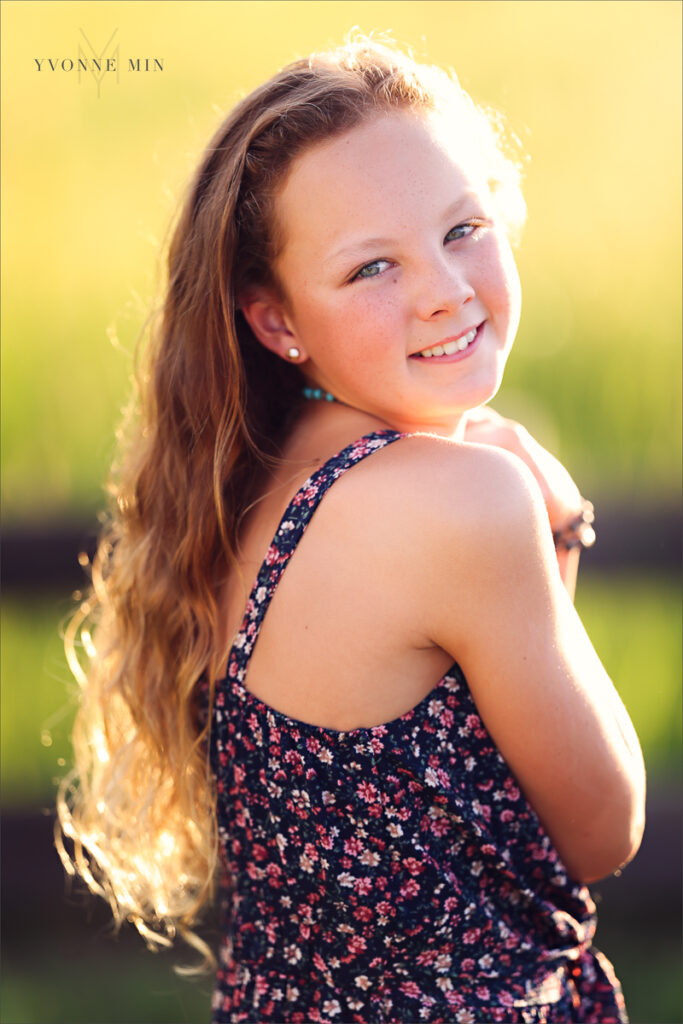 A photograph of a young teenage girl taken at McKay Lake in Westminster, Colorado by Yvonne Min Photography.