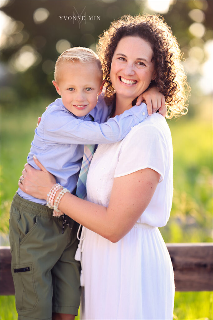 A son and mother hug at McKay Lake during their family photoshoot with Yvonne Min Photography in Westminster, Colorado.
