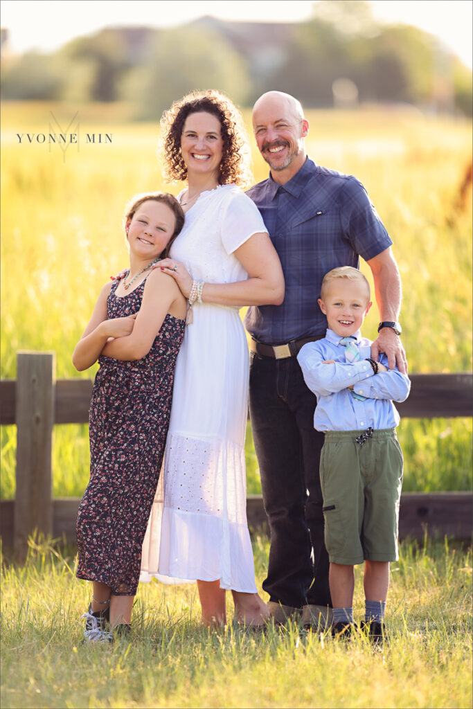 A photograph taken at sunset of a family at McKay Lake by Yvonne Min Photography.
