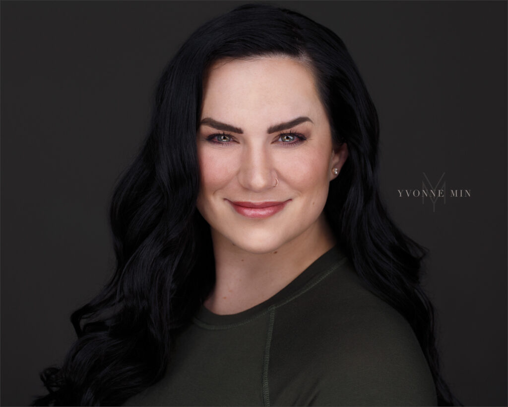 A headshot of a new registered nurse taken in the studio of Yvonne Min Photography in Thornton, Colorado.