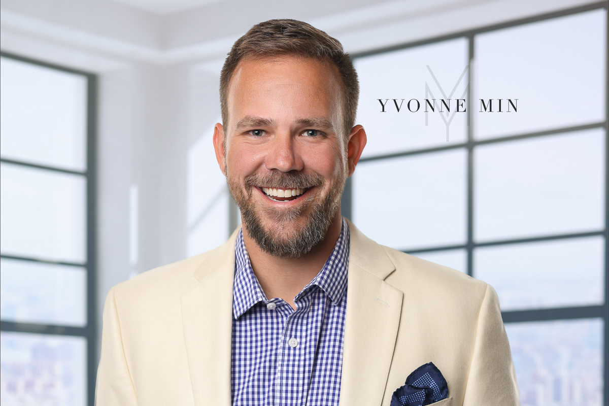A headshot of a young man receiving a coveted award taken in the studio of Yvonne Min Photography in Thornton, Colorado.