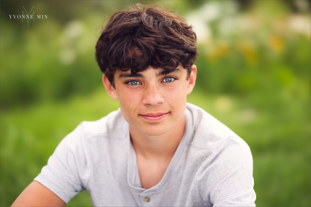 A close-up portrait of a teenage boy taken in Purple Park, Superior, Colorado by Yvonne Min Photography.