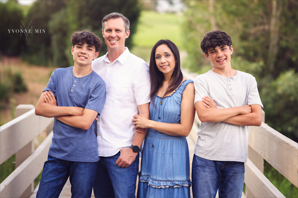 A family photograph taken on the bridge in Purple Park, Superior, Colorado by Yvonne Min Photography.