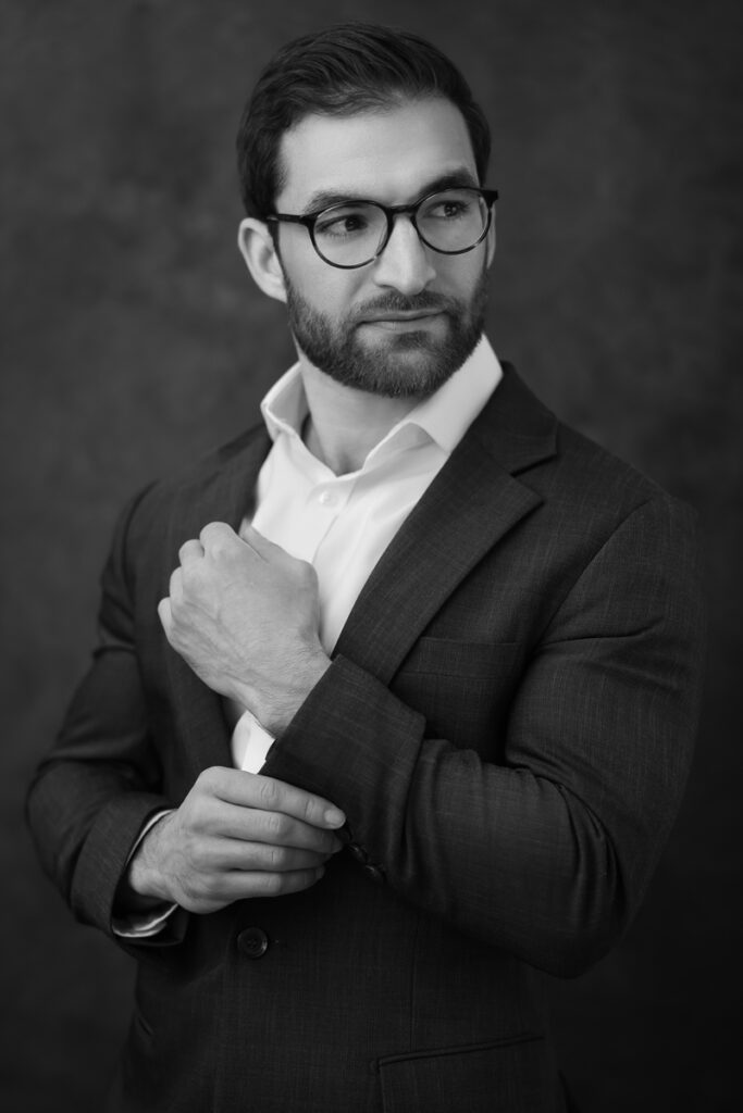 A black and white headshot of a financial expert taken in Cherry Creek, Denver by Yvonne Min Photography.