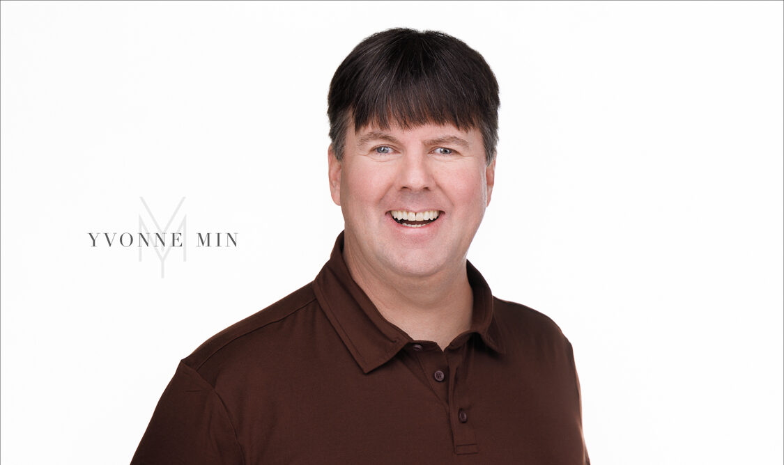A headshot of the founder of the Blind Institute of Technology taken at the Yvonne Min Photography Studio in Thornton, Colorado on a white backdrop.