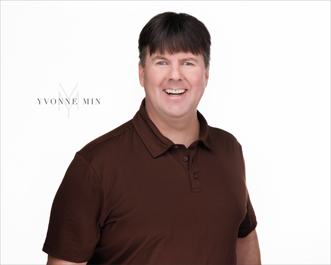 A headshot of the founder of the Blind Institute of Technology taken at the Yvonne Min Photography Studio in Thornton, Colorado on a white backdrop.